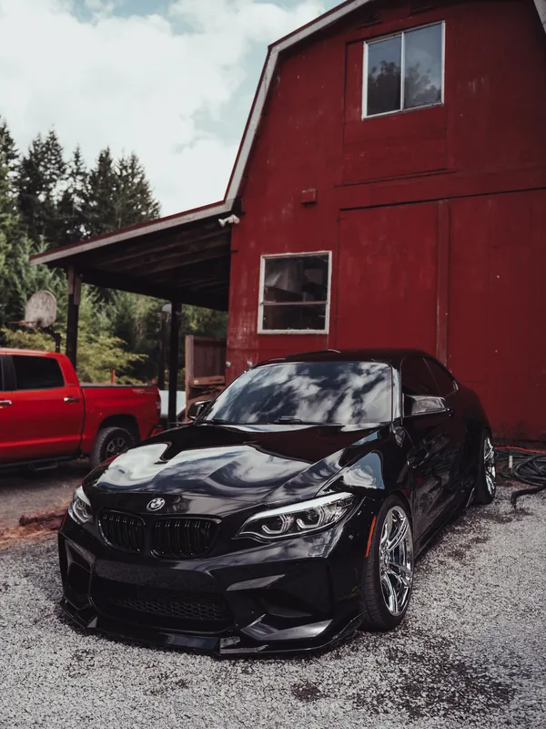 Black BMW M2 with a mirror shine after a detail