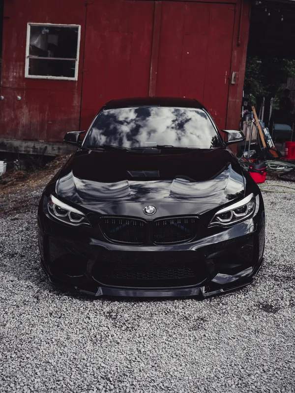 Black BMW M2 from the front after a detail