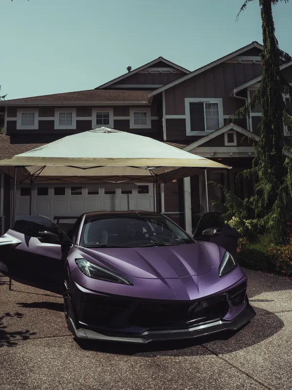 Matte purple Corvette after a detail, parked in a driveway